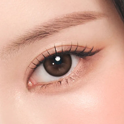 Model wearing OLENS Mood Night choco daily colored contacts for a deep romantic 3D effect