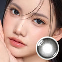 Olens Rain Black 1Day model wearing natural black contacts